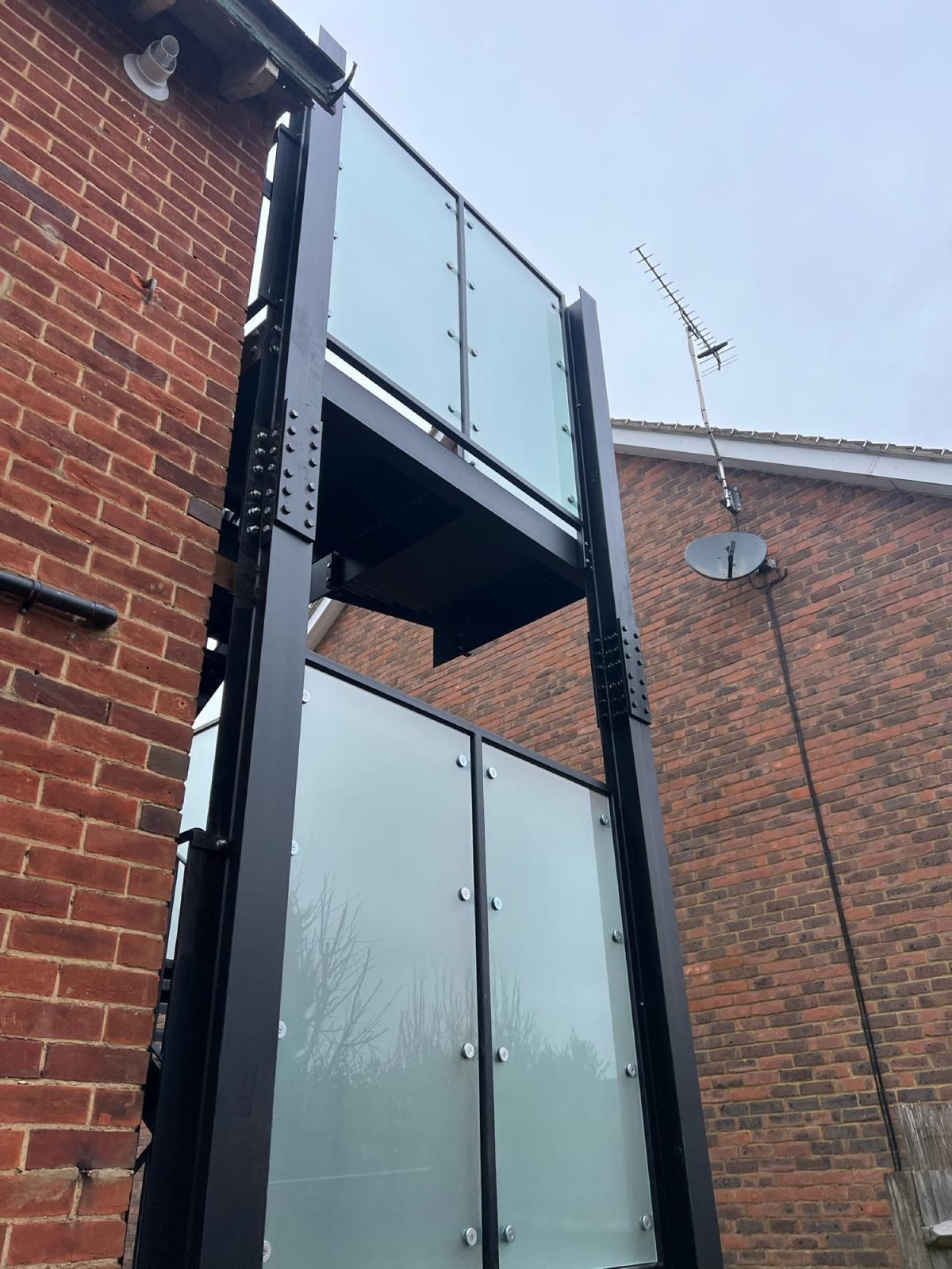 Glass balconies on a modern apartment block