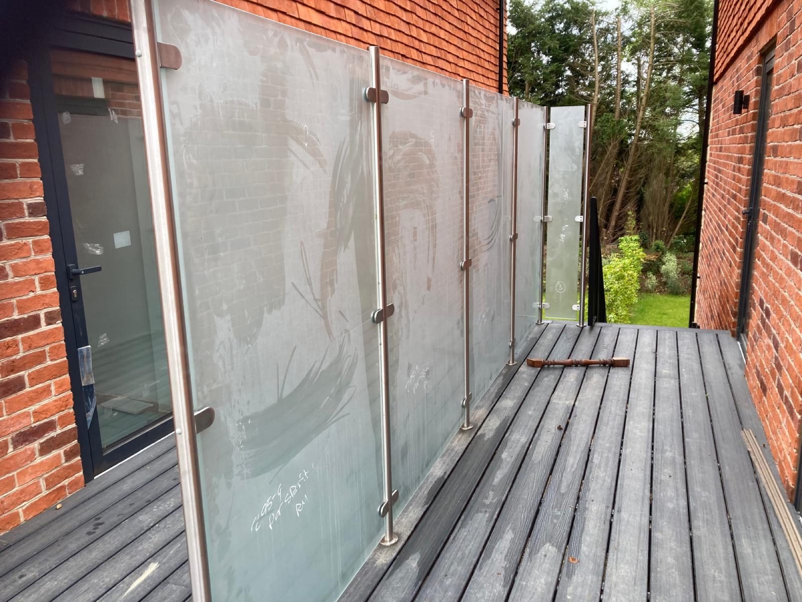 Frosted glass balustrade on a decked balcony